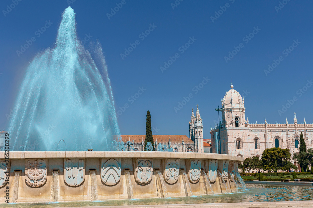 beautiful fountain against the background of the gothic buildings of the Jeronimos Monastery in Lisbon