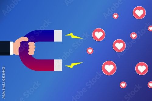 Hand with a magnet attracting hearts. Social media marketing concept. Popularity on social networks. Influencer. Hand holding magnet dragging like signs. Vector illustration, flat style, clip art.