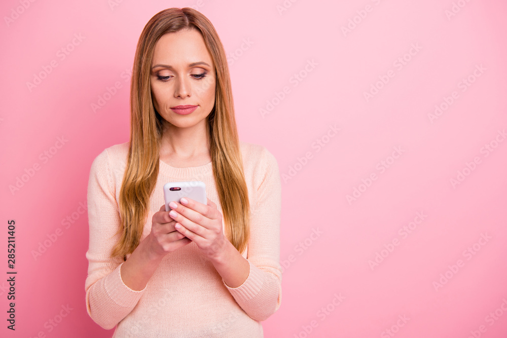 Portrait of serious lady ceo hold hand read news search device isolated over pink background Portrait of serious lady ceo hold hand read news search device isolated over pink background