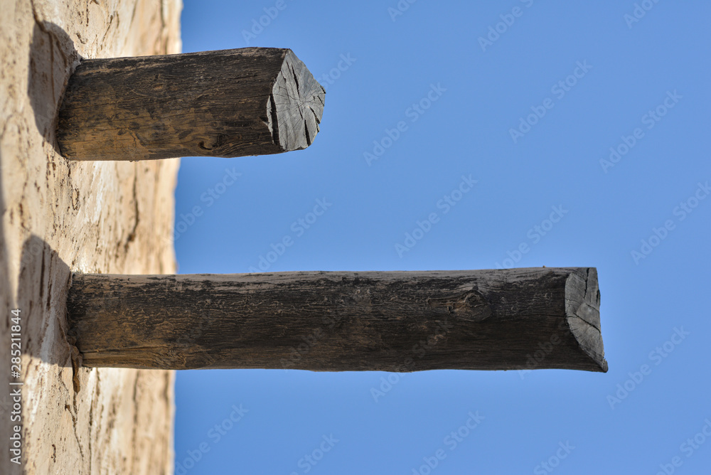 Fototapeta premium Detail of structural wood posts in Souq Wakrah, Qatar