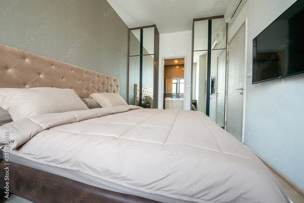Bright and cozy modern bedroom with dressing room Bright and cozy modern bedroom with dressing room