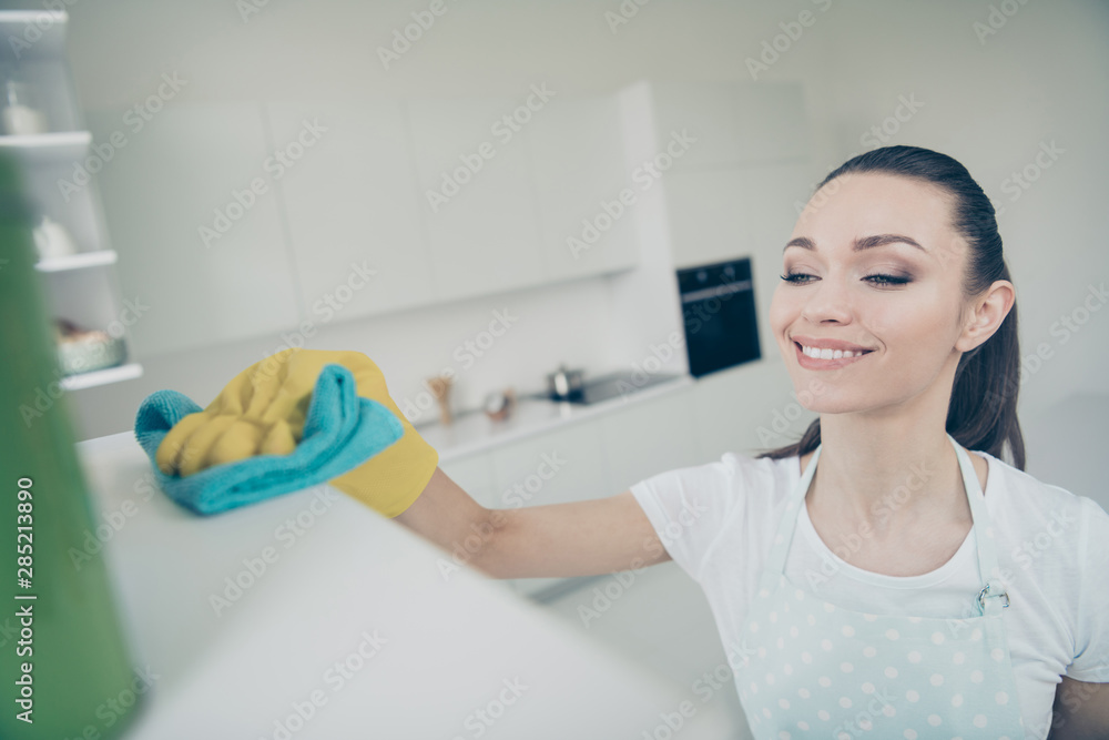 Close up photo of cheerful nice good superb woman cleaning fridge while staying alone at home Close up photo of cheerful nice good superb woman cleaning fridge while staying alone at home