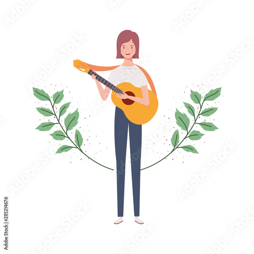 woman with acoustic guitar and branches and leaves in the background