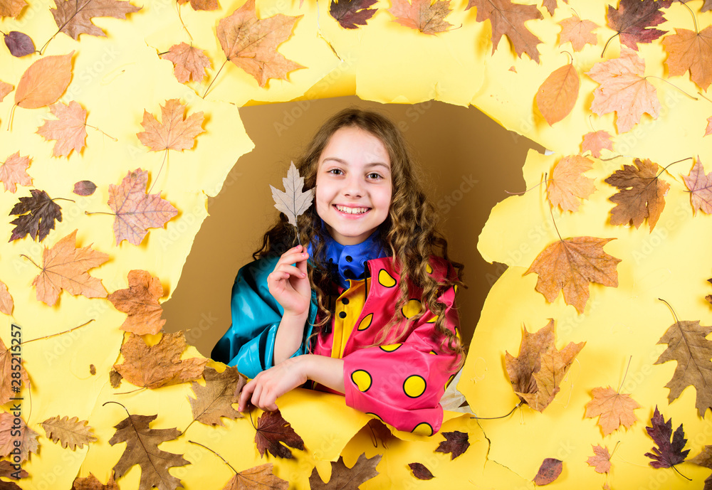 season forecast. kid in autumn leaves. autumn beauty. Happy childhood. little girl in trendy raincoat. child in positive mood. little girl in rain protection. Fall fashion. Autumn style season forecast. kid in autumn leaves. autumn beauty. Happy childhood. little girl in trendy raincoat. child in positive mood. little girl in rain protection. Fall fashion. Autumn style