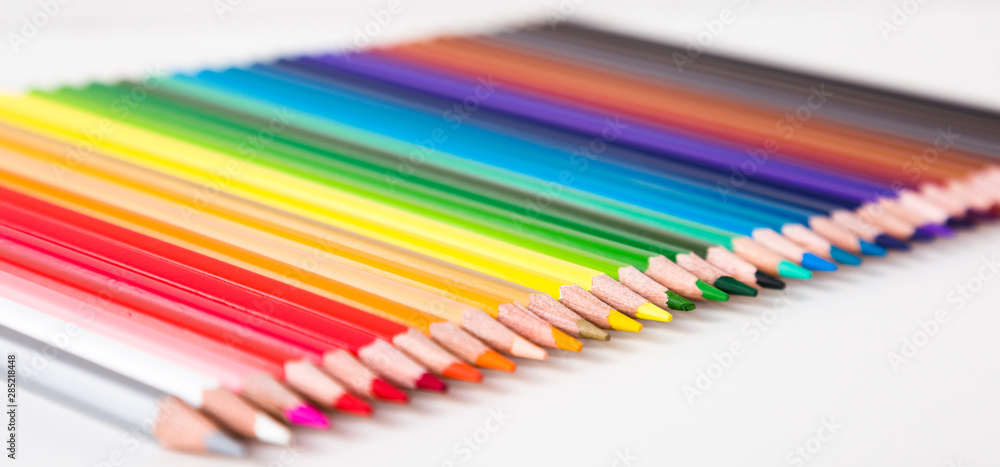 colored pencils lying in row