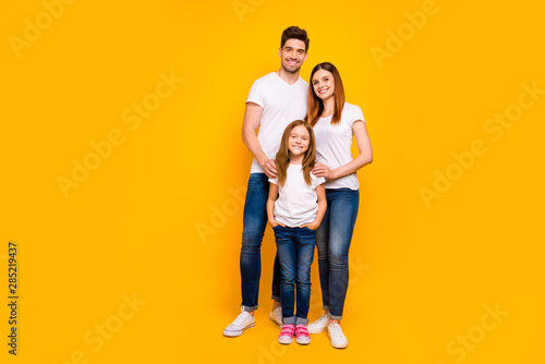 Full length photo of family spending leisure time together wear casual outfit isolated yellow background © deagreez