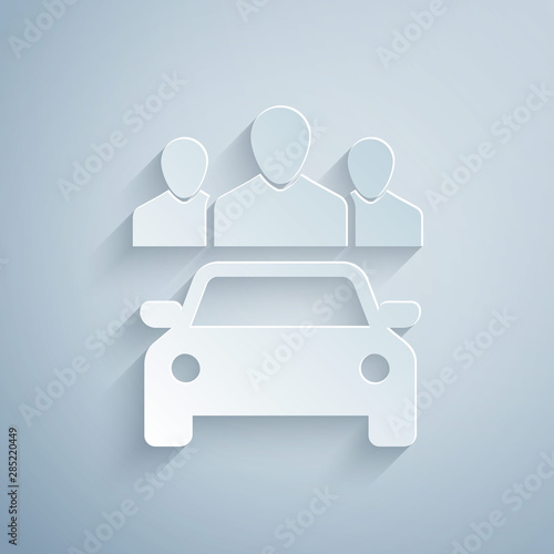 Paper cut Car sharing with group of people icon isolated on grey background. Carsharing sign. Transport renting service concept. Paper art style. Vector Illustration