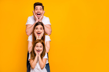 Portrait of three nice attractive charming lovely cute careful cheerful cheery stunned person in order of hierarchy unexpected great news isolated over bright vivid shine yellow background