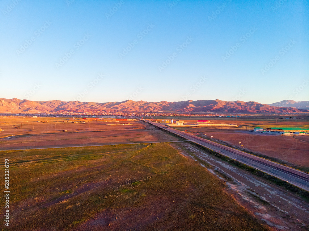 Aerial view of the road leading to Dogubayazit from Igdir. Plateau around Mount Ararat, mountains and hills. Eastern Turkey on the border with Armenia and Iran