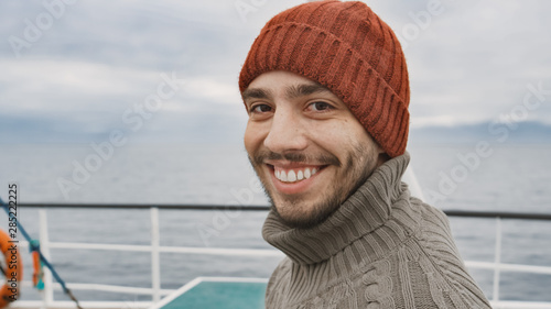 Portrait of Casualy Dressed Smiling Fisherman on Commercial Fishing Boat.