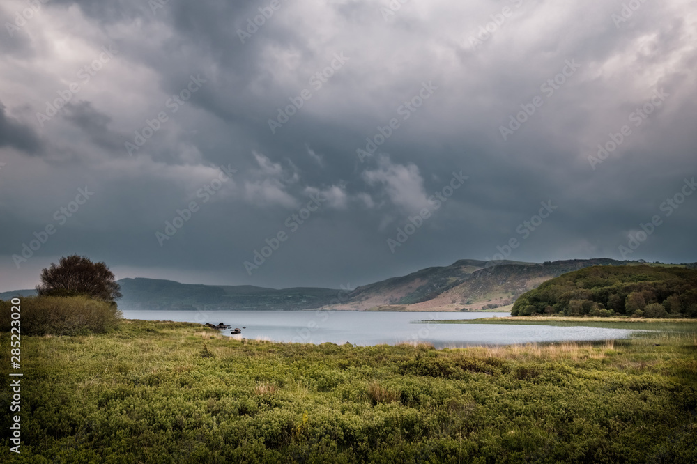 Dark clouds over Lough Caragh in Ireland Dark clouds over Lough Caragh in Ireland