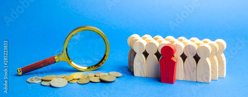 Coins, magnifying glass and a team of employees. Business valuation concept - process of determining the economic value of a whole business or company unit. Financial market / statement analysis