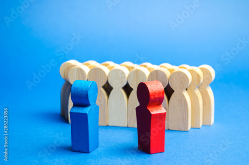 Blue and red people stand in front of a crowd. Conflict of interest concept. Two opponents. Dispute. Search for compromises. Social problems. Business competition. Political Debate