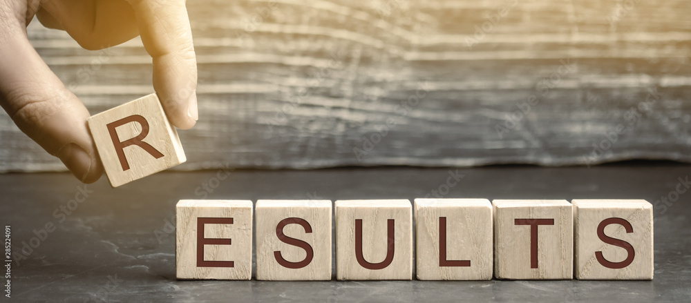 Businessman puts wooden blocks with the word Results. The concept of annual financial statements. Analysis of profits and revenues in the company. Achievements of the business team. Work on the errors Businessman puts wooden blocks with the word Results. The concept of annual financial statements. Analysis of profits and revenues in the company. Achievements of the business team. Work on the errors