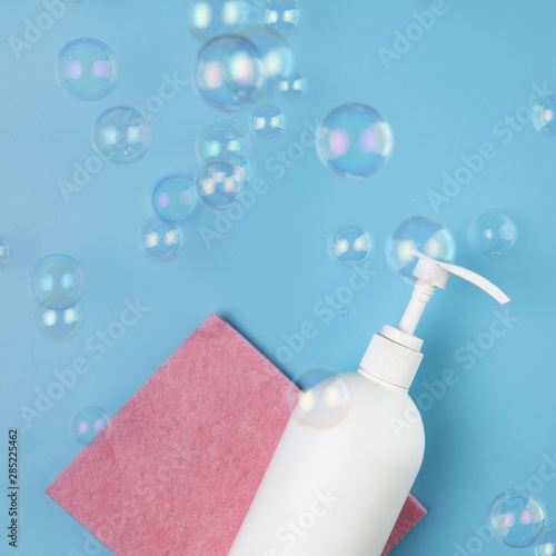 Flat lay arrangement with soap bottle and bubbles photo