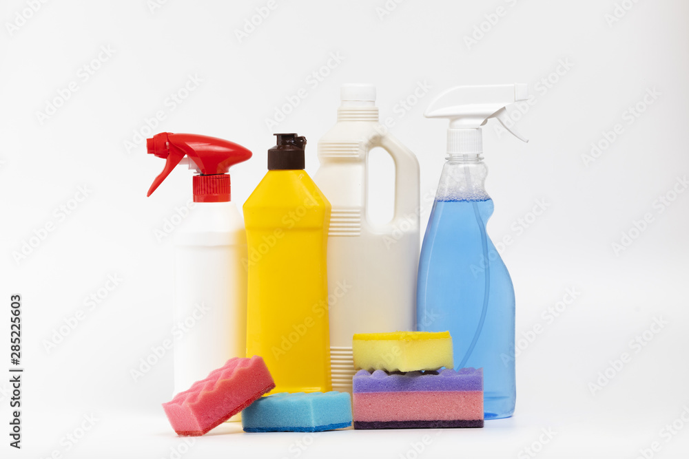 Arrangement with cleaning products and colourful sponges Arrangement with cleaning products and colourful sponges