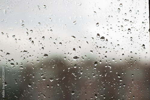 Raindrops on glass, raindrops on a transparent window.