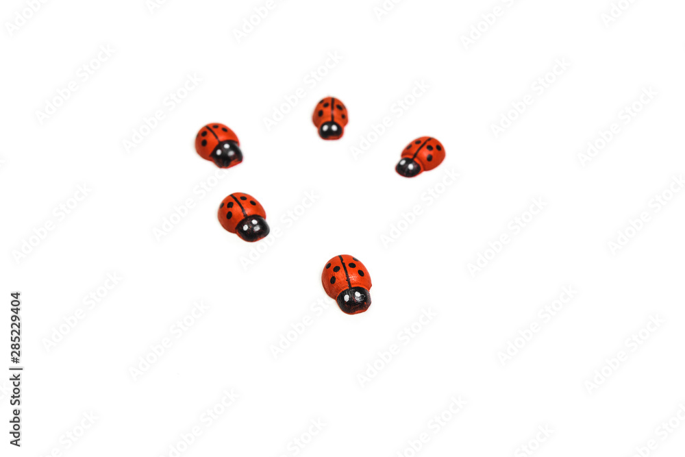 Fototapeta premium Toy ladybug red on a white background