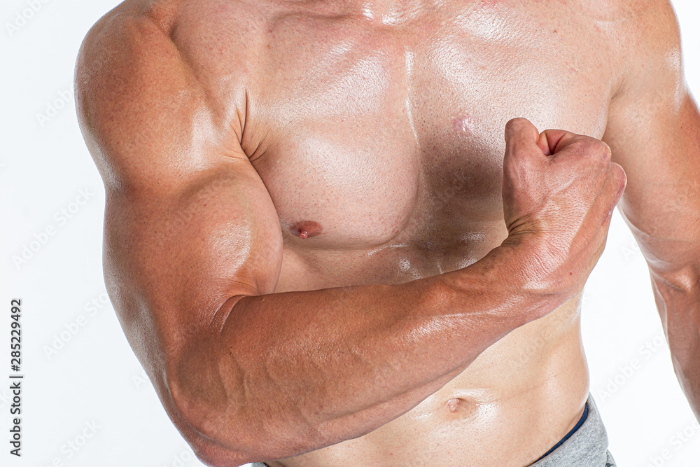 Fototapeta premium Brutal strong athletic bodybuilding men posing in studio. Bodybuilding and healty life concept.