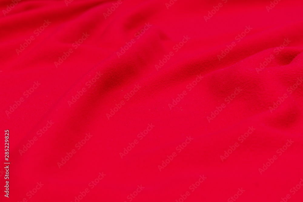 Red crumpled blanket, texture, background, top view Red crumpled blanket, texture, background, top view