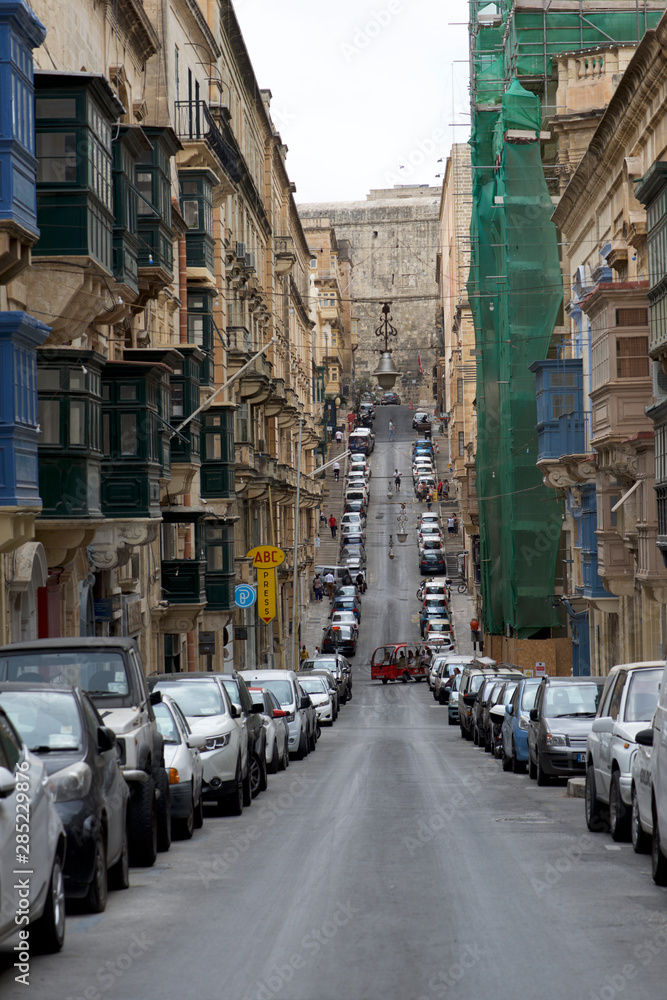 VALLETTA, MALTA - JAN 14, 2014: panoramic view of Old bakery street in Valletta in Malta, Mediterranean sea, jul 6, 2019. Panoramic view of typical Street in Valletta, Malta