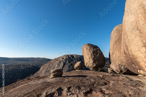 Huge boulders balance perfectly on Pyramid Rock on a clear and sunny day in Girraween NP, Queensland, Australia