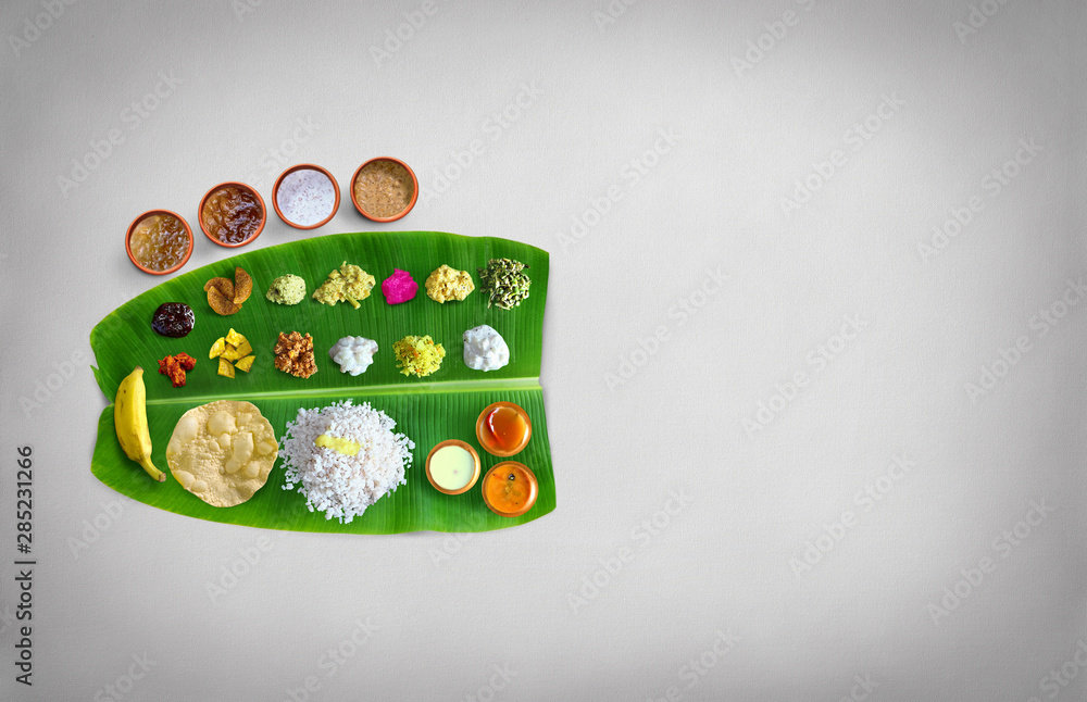 Traditional food Onam Sadya served on a banana leaf on Festival day onam,  Vegetarian meal with rice and curries, kerala food, Kerala, india, Stock  Photo | Adobe Stock