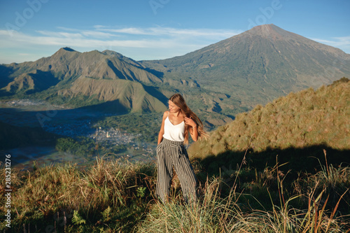 Photography Traveller enjoying views wonderful farmland scenery at Sembalun near Rinjani volcano in Lombok, Indonesia