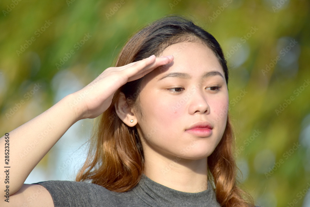 A Filipina Female Saluting