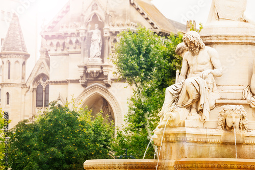 Fountain and church of Sainte Perpetue in Nimes photo