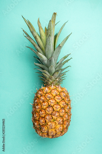 Pineapple on green background.