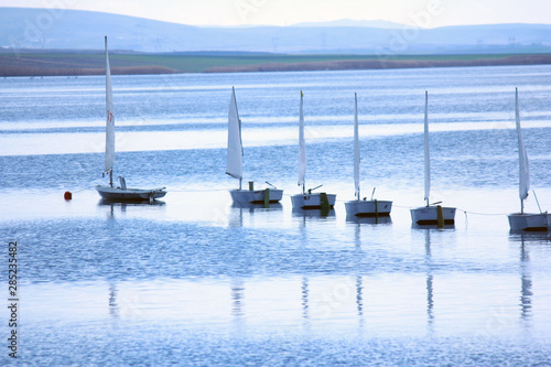 small sailboats on the lake