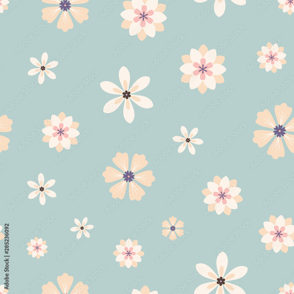 Seamless pattern of cream flowers on a blue background.