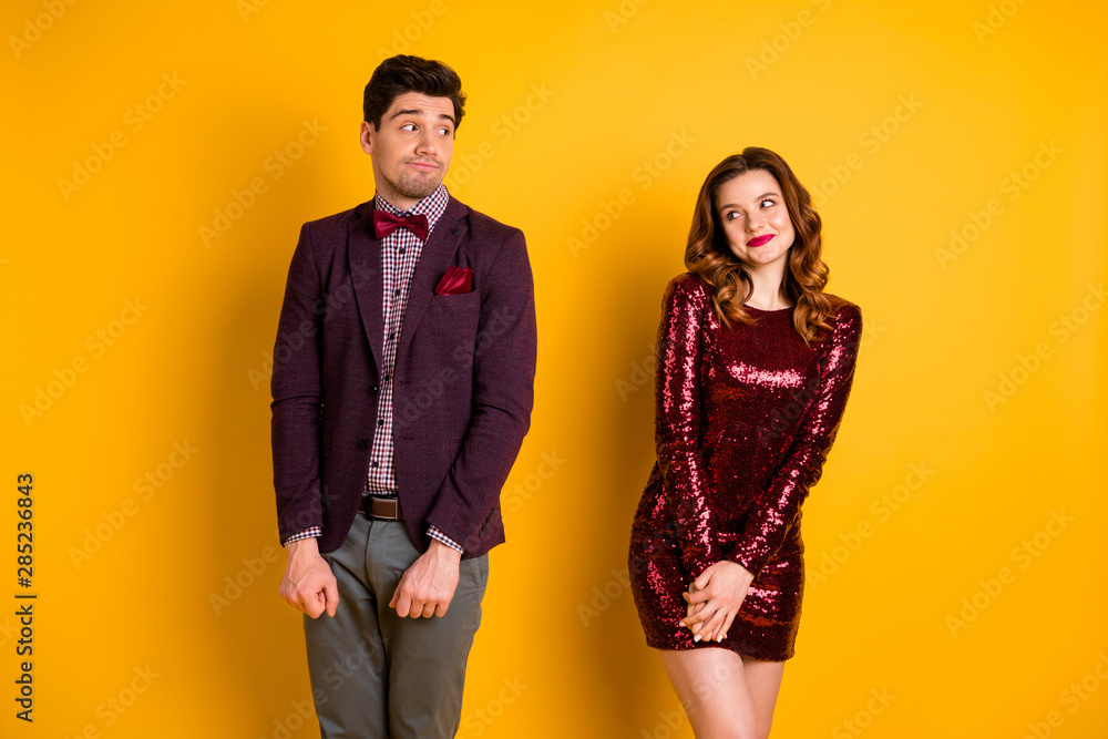 Portrait of his he her she nice well-dressed attractive lovely funny classy chic fascinating cheerful confused people meeting 1st time isolated over bright vivid shine yellow background