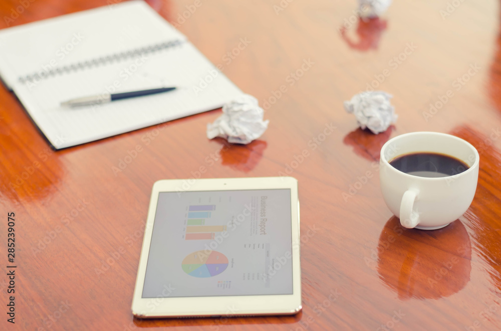 business concept tablet and notepad on desk business concept tablet and notepad on desk