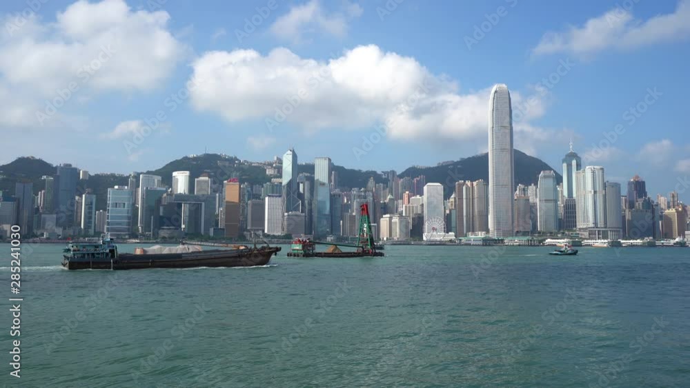 Hong Kong skyline from across the waterfront, camera pan Hong Kong skyline from across the waterfront, camera pan