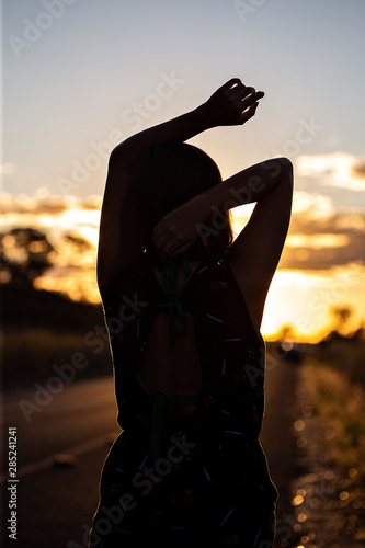 silhouette of a woman in the sunset