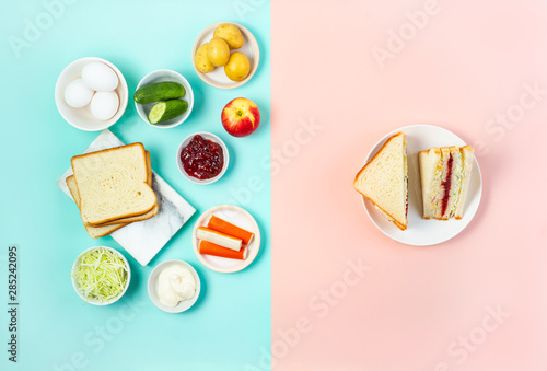 Trendy Korean sandwich inkigayo with ingredients on two-color pastel background, top view, horizontal photo