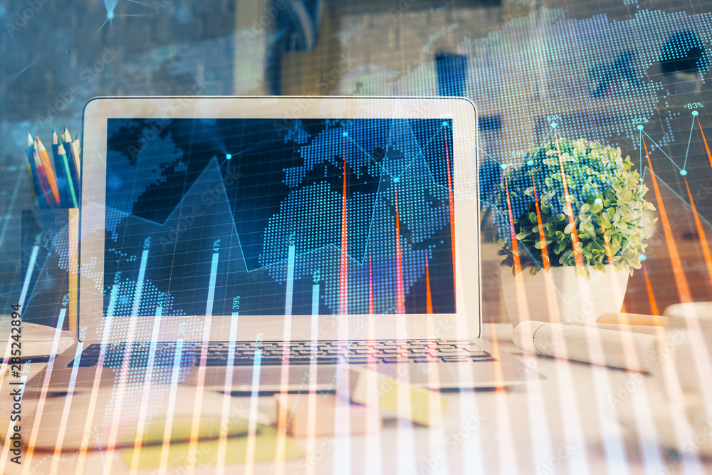 Double exposure of chart and financial info and work space with computer background. Concept of international online trading. Double exposure of chart and financial info and work space with computer background. Concept of international online trading.