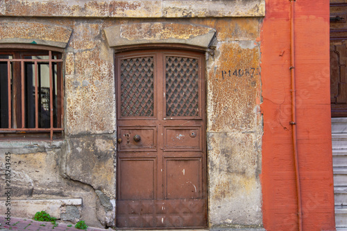 Brick stone wall and colorful window in street of Balat in Istanbul © Alohadunya