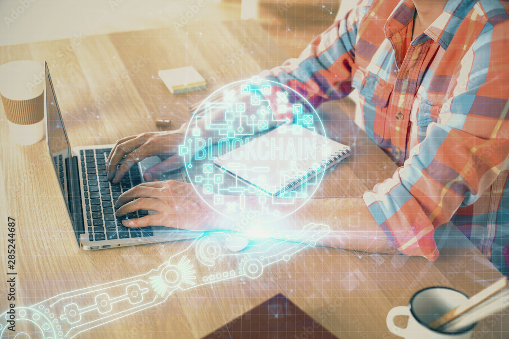 Blockchain theme hologram with man working on computer on background. Concept of crypto chain. Double exposure. Blockchain theme hologram with man working on computer on background. Concept of crypto chain. Double exposure.