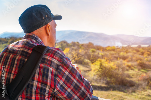 portrait of a man looking into the distance on the horizon tourism concept