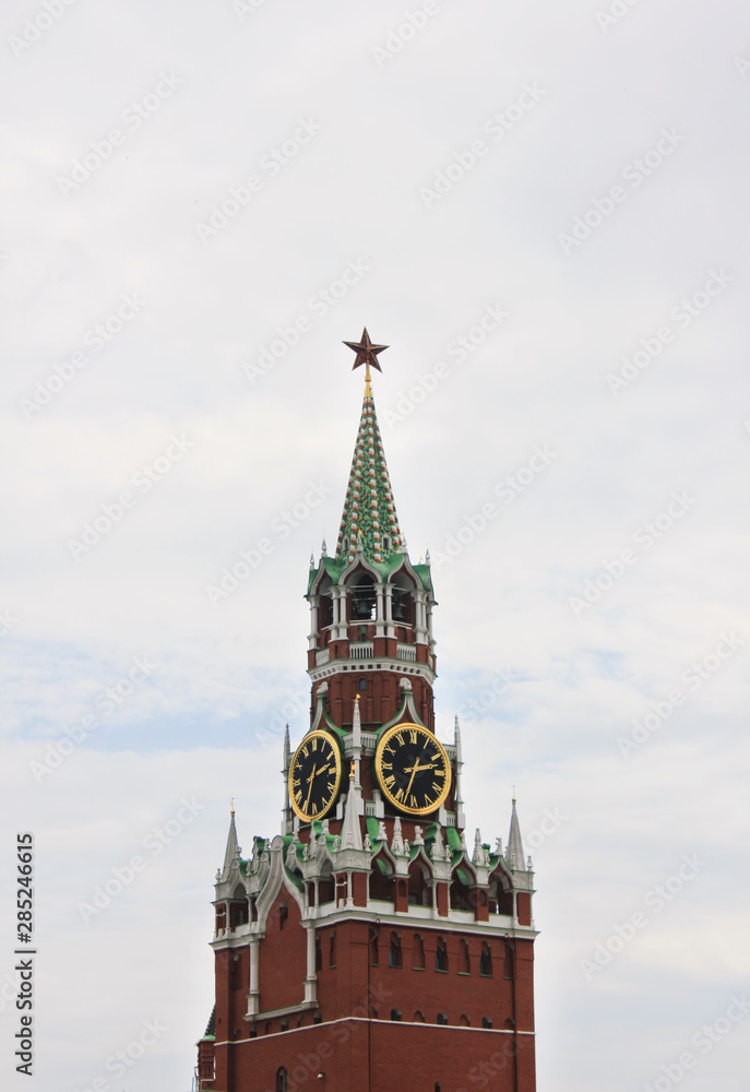 Spasskaya tower of Moscow's Kremlin building isolated against cloudy sky background Spasskaya tower of Moscow's Kremlin building isolated against cloudy sky background