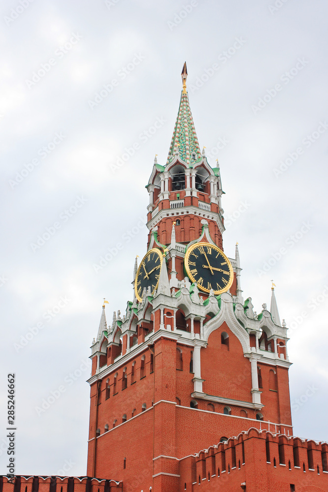 Moscow's Kremlin Spasskaya tower on Red Square in Russia. Kremlin building facade close up on moody cloudy day in Moscow city, capital of Russia Moscow's Kremlin Spasskaya tower on Red Square in Russia. Kremlin building facade close up on moody cloudy day in Moscow city, capital of Russia