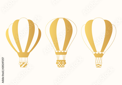 Golden hot air balloons silhouettes set. Cute vector aerostat icons. Sky transport for journey. Concept for children print.