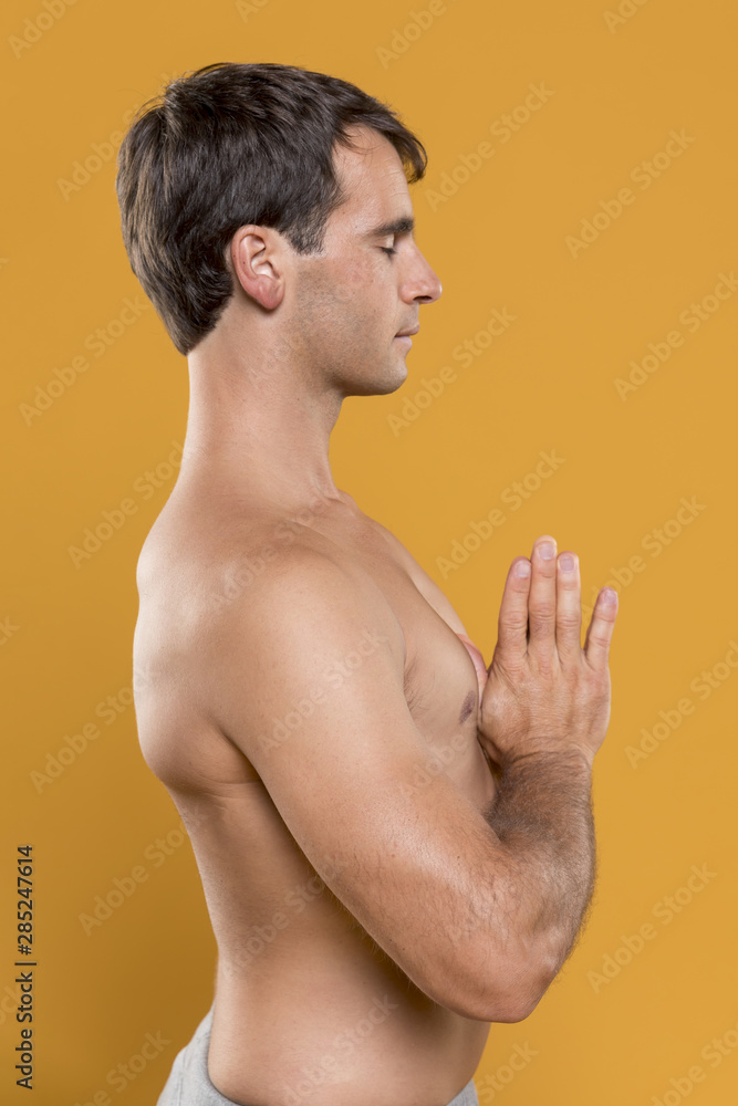 Fototapeta premium Sideways man meditating medium shot