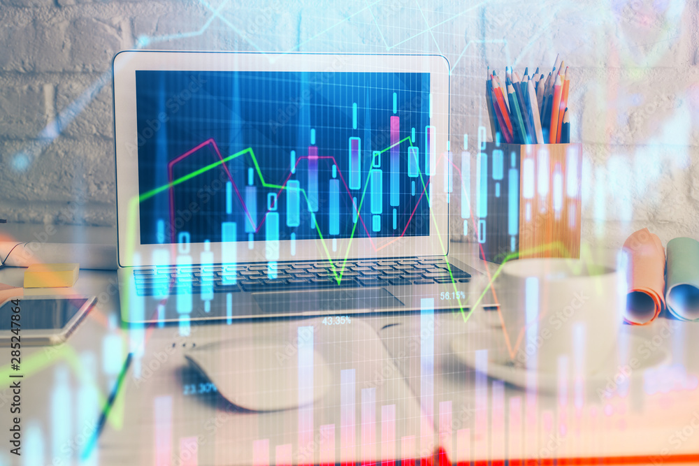 Forex market graph hologram and personal computer on background. Double exposure. Concept of investment. Forex market graph hologram and personal computer on background. Double exposure. Concept of investment.