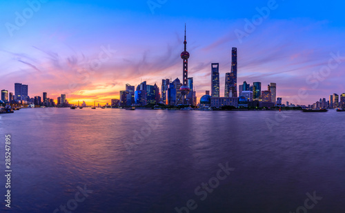 Shanghai skyline and modern urban buildings at sunrise panoramic view.