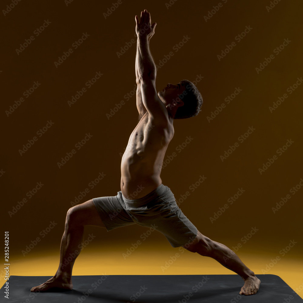 Man doing exercise on yoga mat