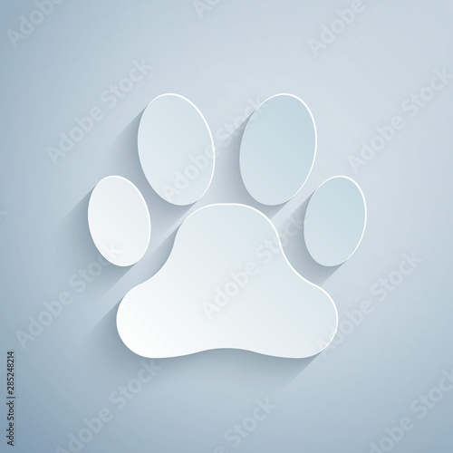 Paper cut Paw print icon isolated on grey background. Dog or cat paw print. Animal track. Paper art style. Vector Illustration